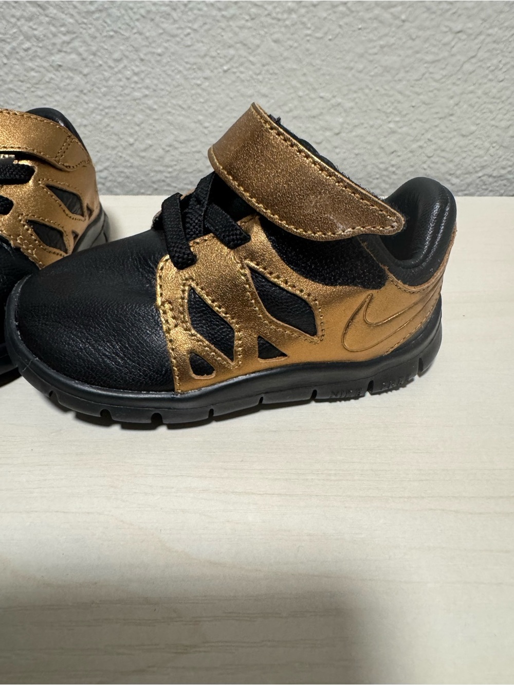 Nike Toddler Black and Metallic Gold Velcro Sneakers